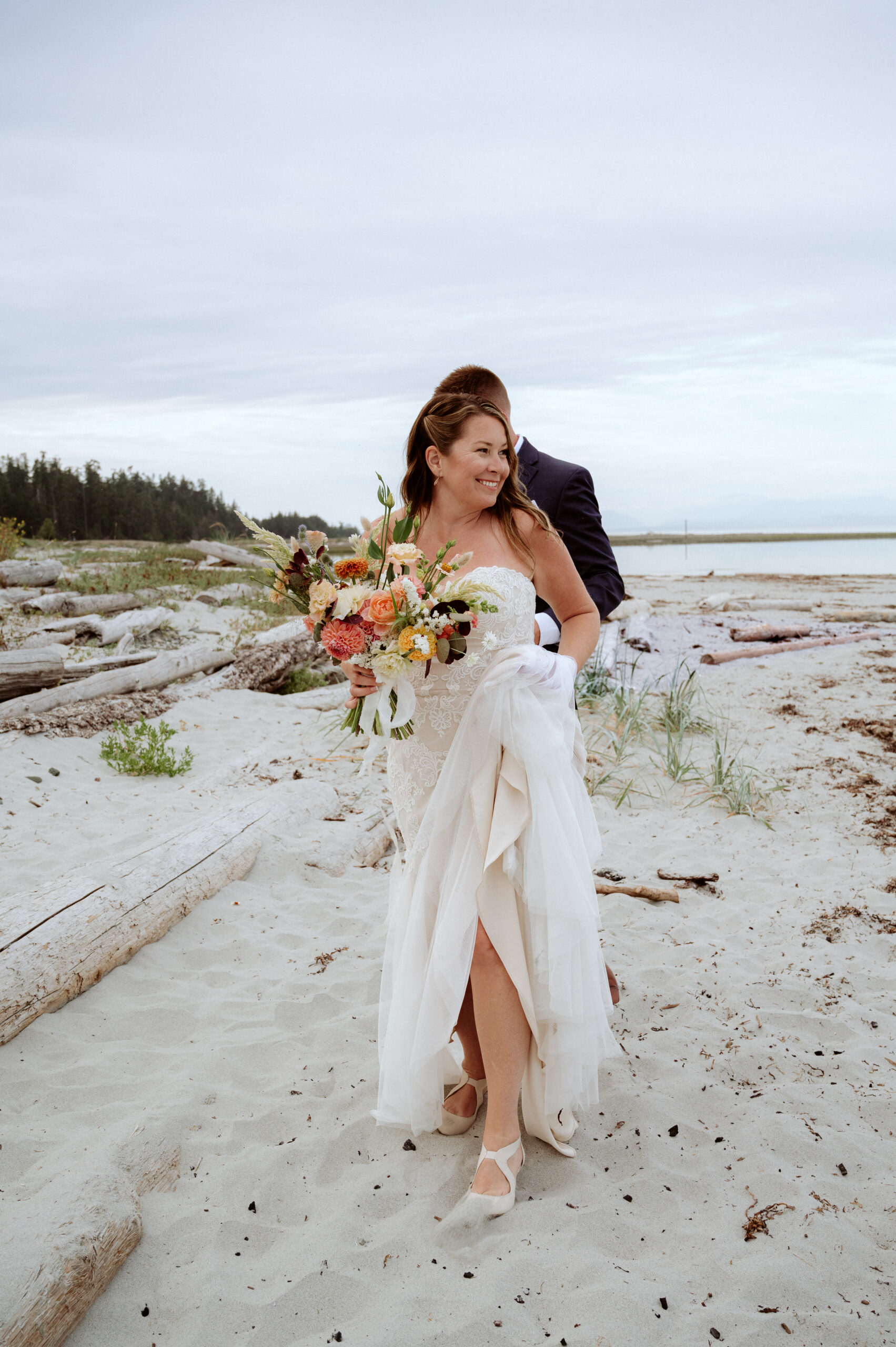 Satratogo Beach Elopement women walking in wedding dress on the beach/